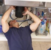 a plumber in Salinas CA installs a new garbage disposal