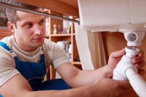 a plumber in Salinas replaces a sink drain line